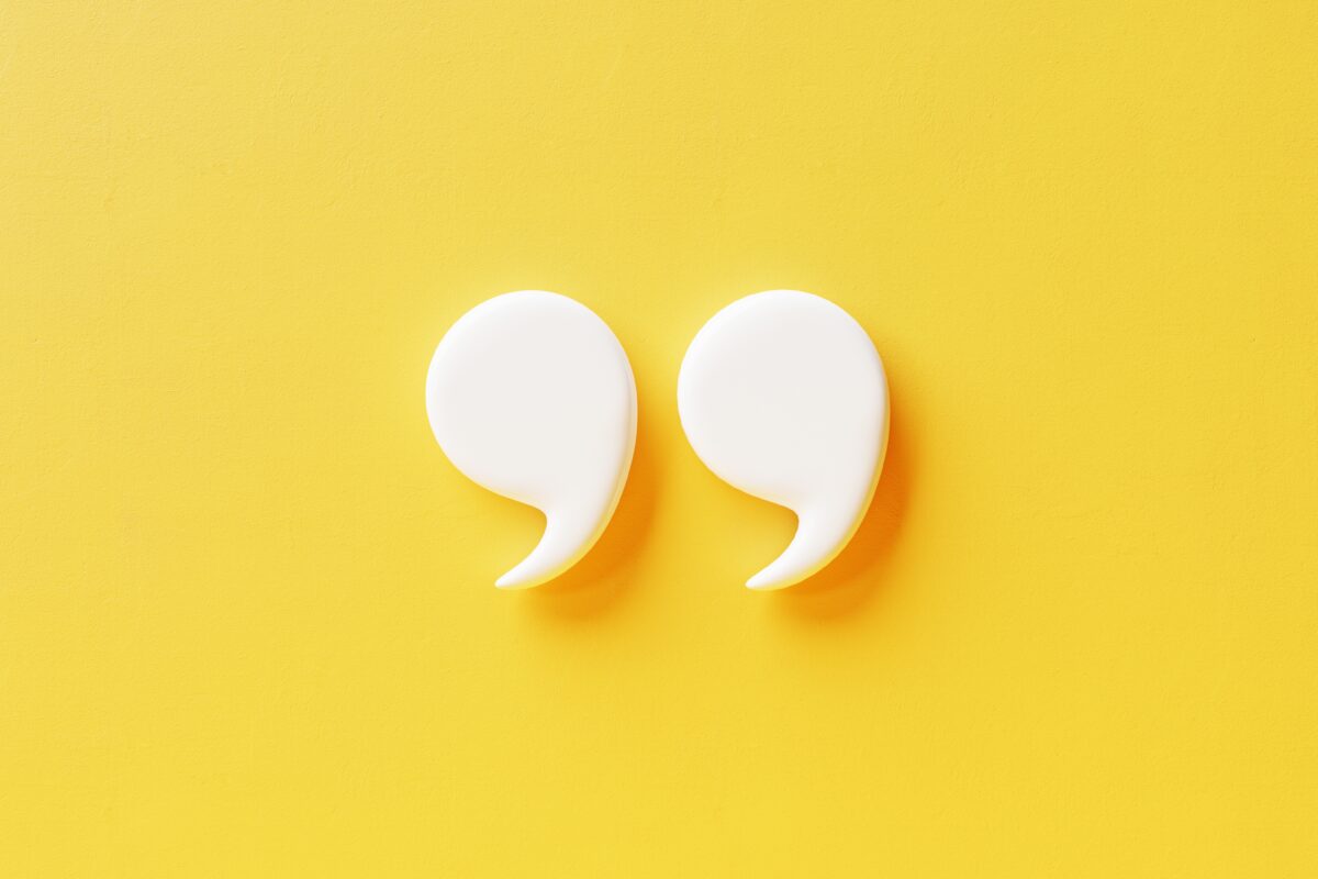 Quotation mark on yellow wall, White quotation mark 3d illustration.